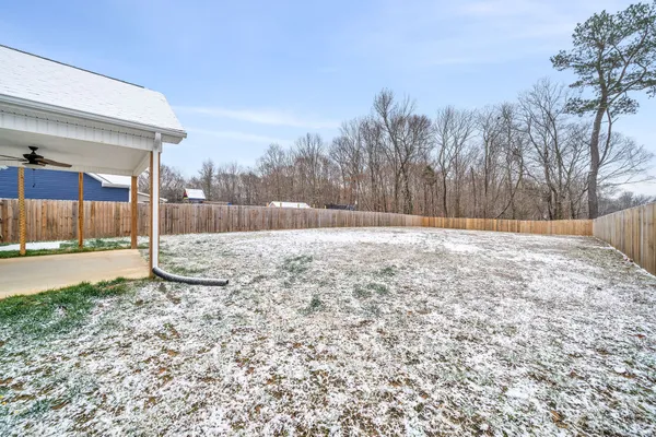 a view of a backyard of the house