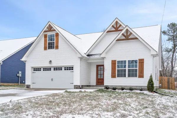 a front view of a house with a rug