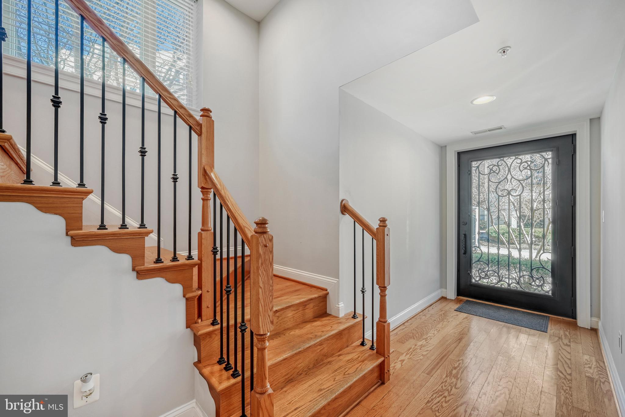 900 Valencia Court, Unit 188 Baltimore, MD 21230 - Photo 11 of 46 a view of staircase with railing and a window