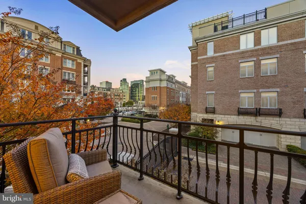 a view of a balcony with furniture