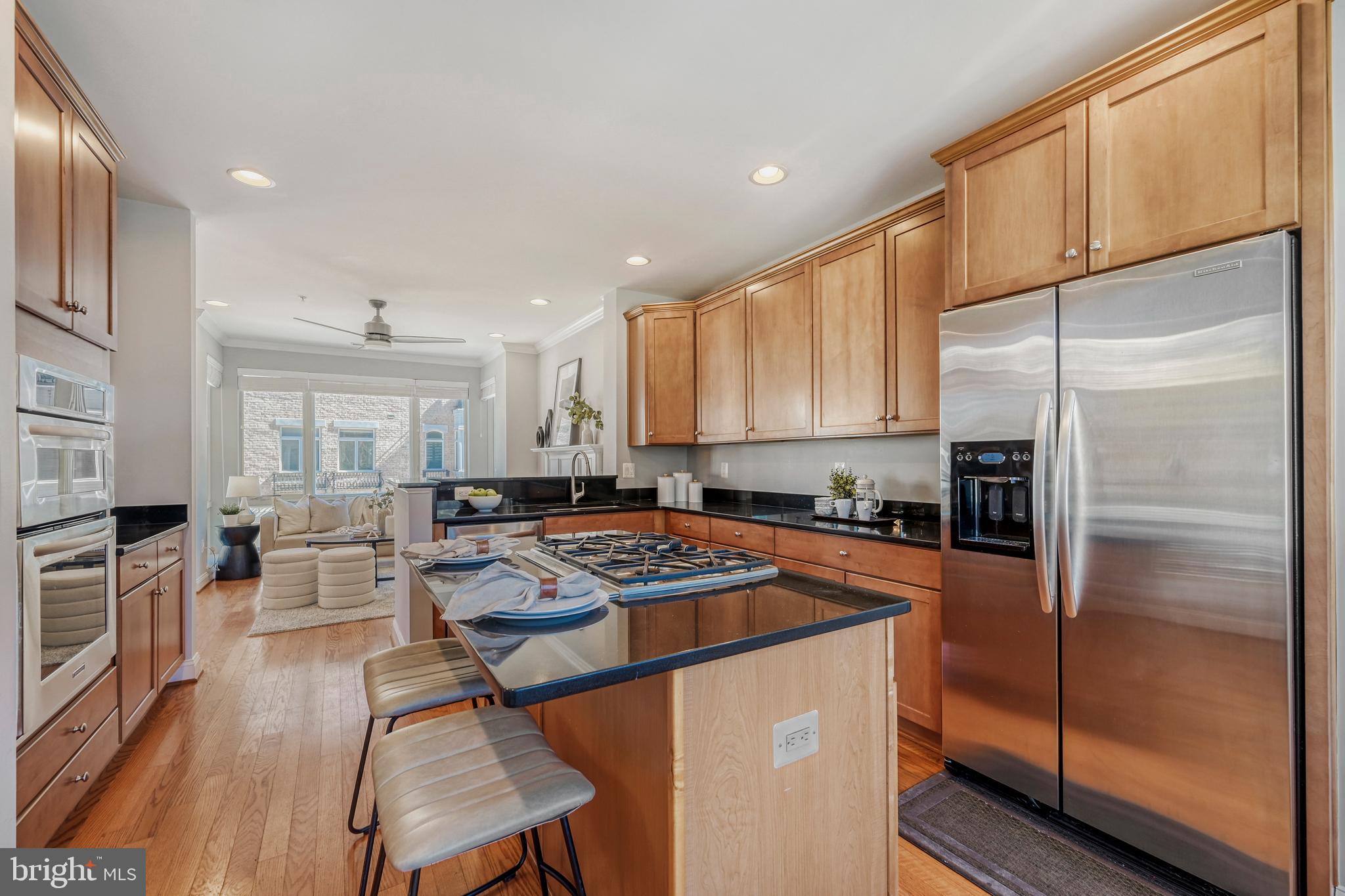 900 Valencia Court, Unit 188 Baltimore, MD 21230 - Photo 21 of 46 a kitchen with stainless steel appliances granite countertop a refrigerator stove microwave and sink