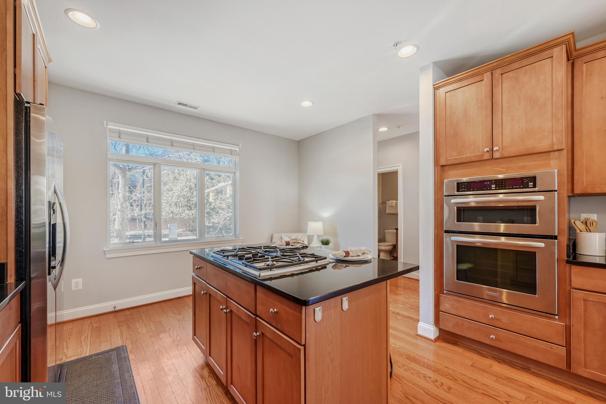 900 Valencia Court, Unit 188 Baltimore, MD 21230 - Photo 24 of 46 a kitchen that has a stove and a refrigerator