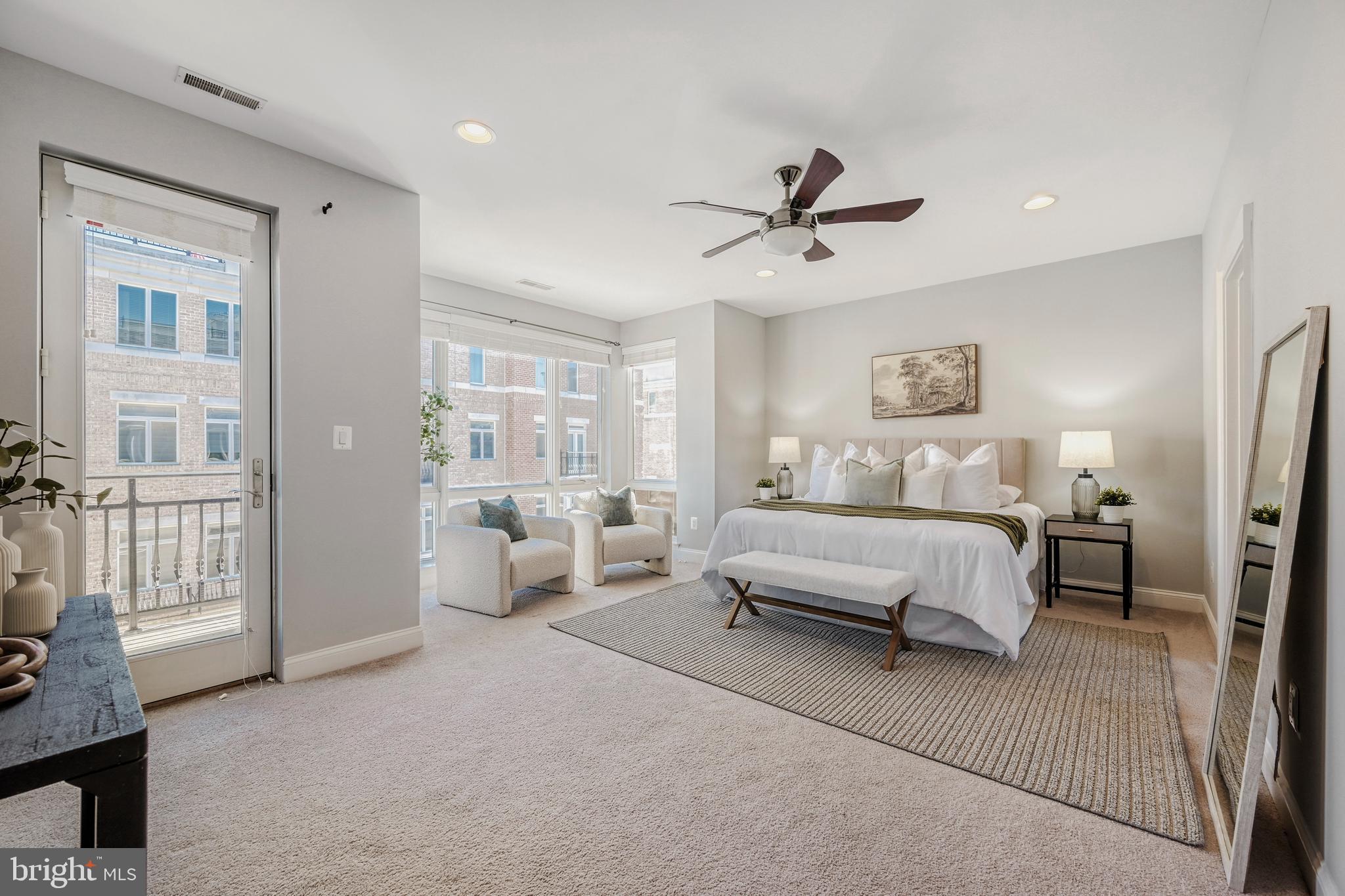 900 Valencia Court, Unit 188 Baltimore, MD 21230 - Photo 26 of 46 a spacious bedroom with a bed and glass door