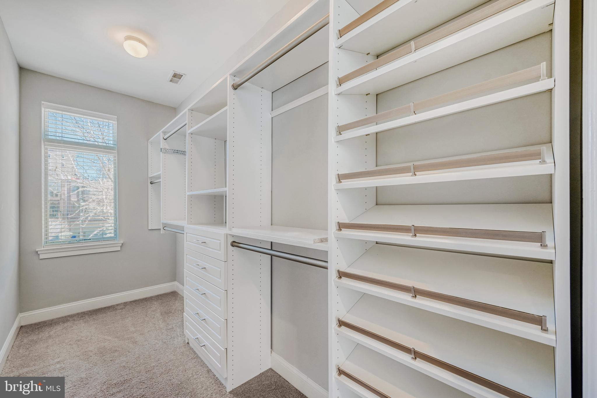 900 Valencia Court, Unit 188 Baltimore, MD 21230 - Photo 29 of 46 a view of walk in closet with empty racks