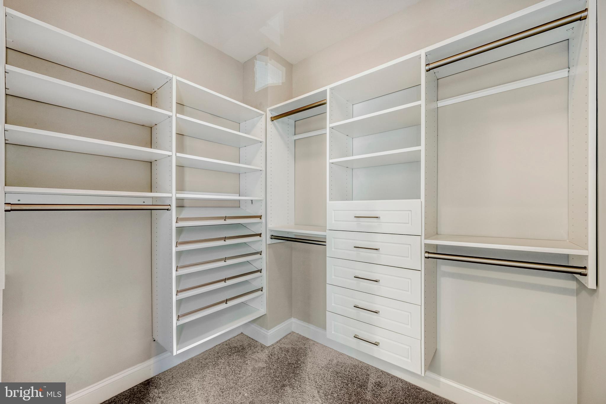 900 Valencia Court, Unit 188 Baltimore, MD 21230 - Photo 30 of 46 a view of walk in closet with empty racks
