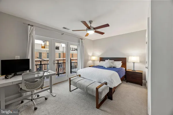a bedroom with a bed and a desk