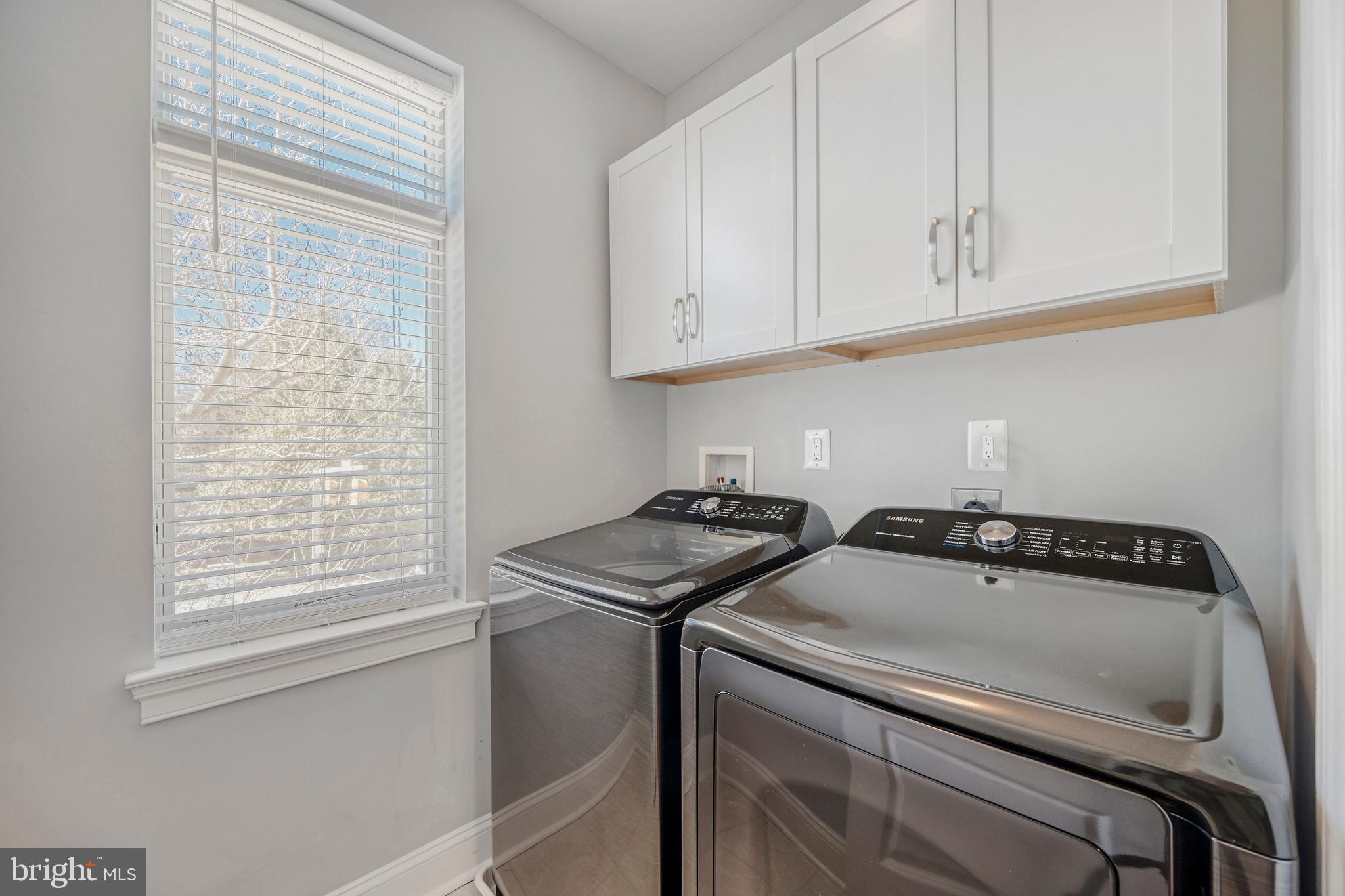 900 Valencia Court, Unit 188 Baltimore, MD 21230 - Photo 38 of 46 a kitchen with white cabinets and a stove top oven
