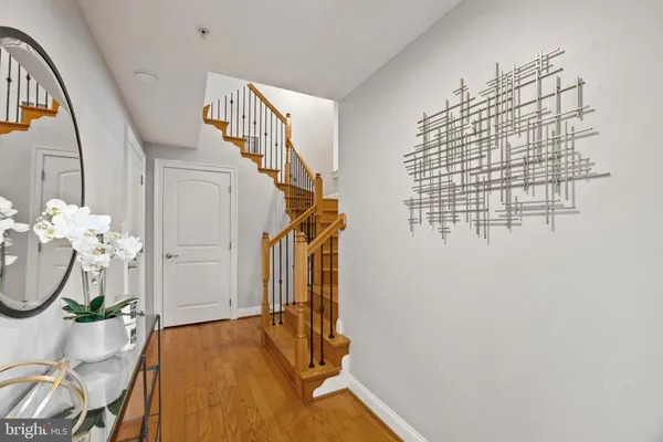 a view of entryway with wooden floor