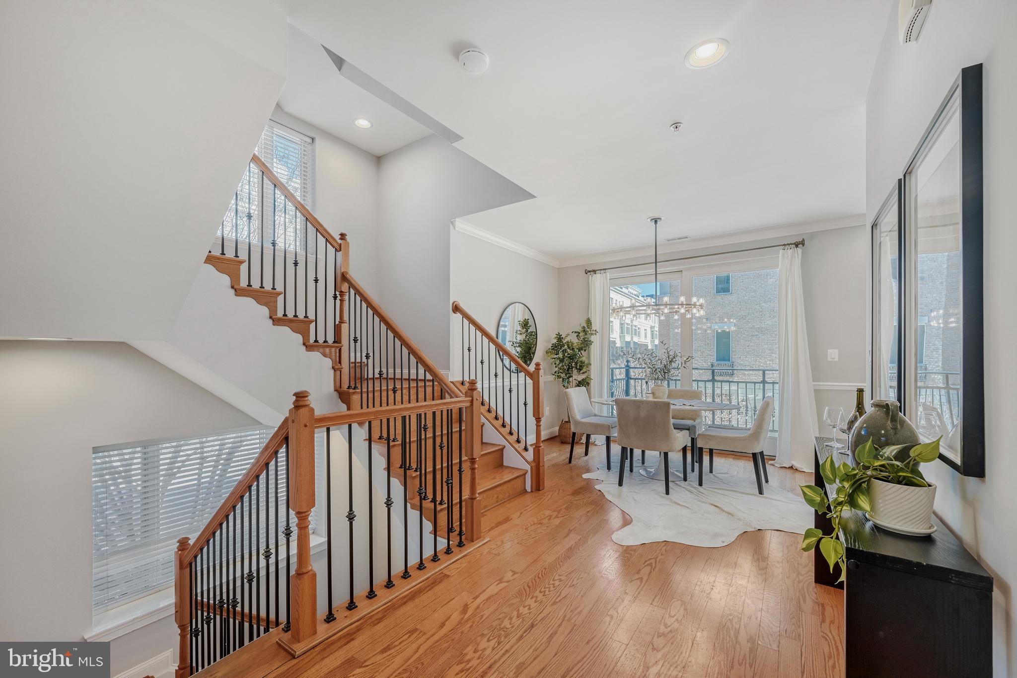 900 Valencia Court, Unit 188 Baltimore, MD 21230 - Photo 7 of 46 a dining room with furniture entryway and wooden floor