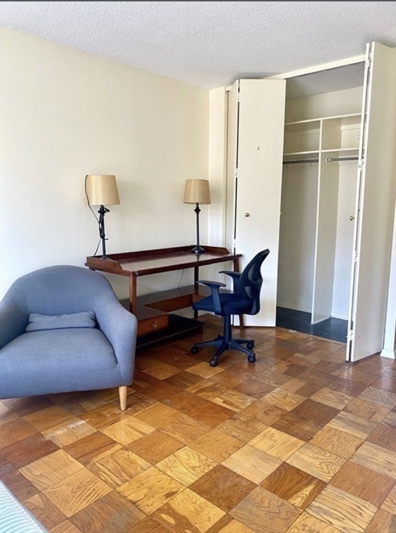 151 Tremont Street, Unit 9S Boston, MA 02111 - Photo 11 of 11 a view of workspace with lounge chair