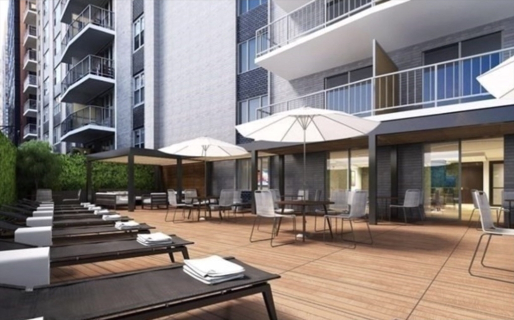 151 Tremont Street, Unit 9S Boston, MA 02111 - Photo 6 of 11 a view of a building with sitting area