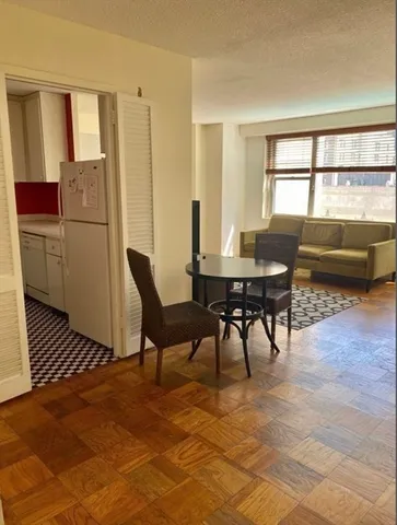 a view of a livingroom with furniture and window
