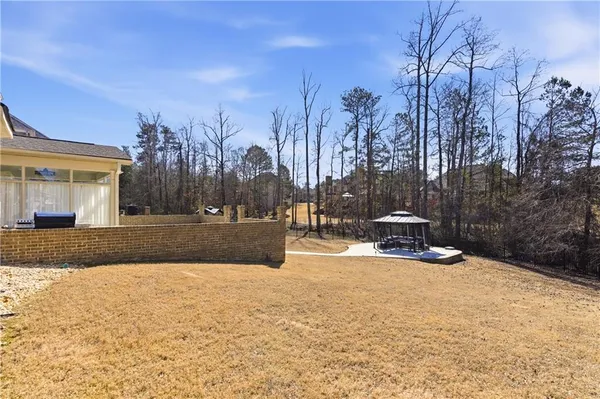 a view of a backyard with sitting area