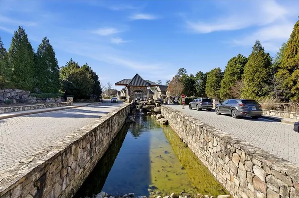 an aerial view of a house with yard swimming pool and outdoor seating