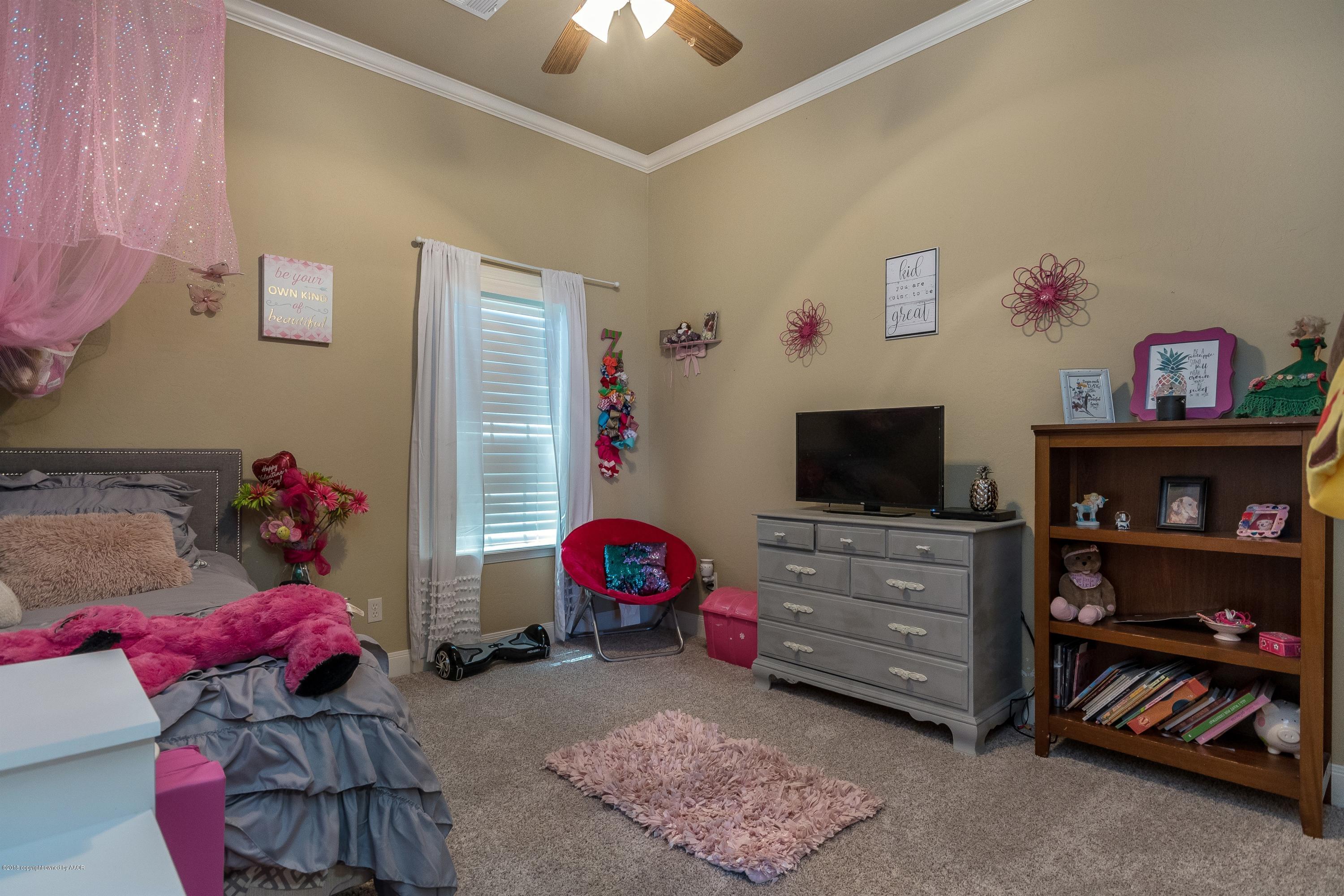 3909 Arden Road Amarillo, TX 79118 - Photo 14 of 20 a living room with furniture and a flat screen tv
