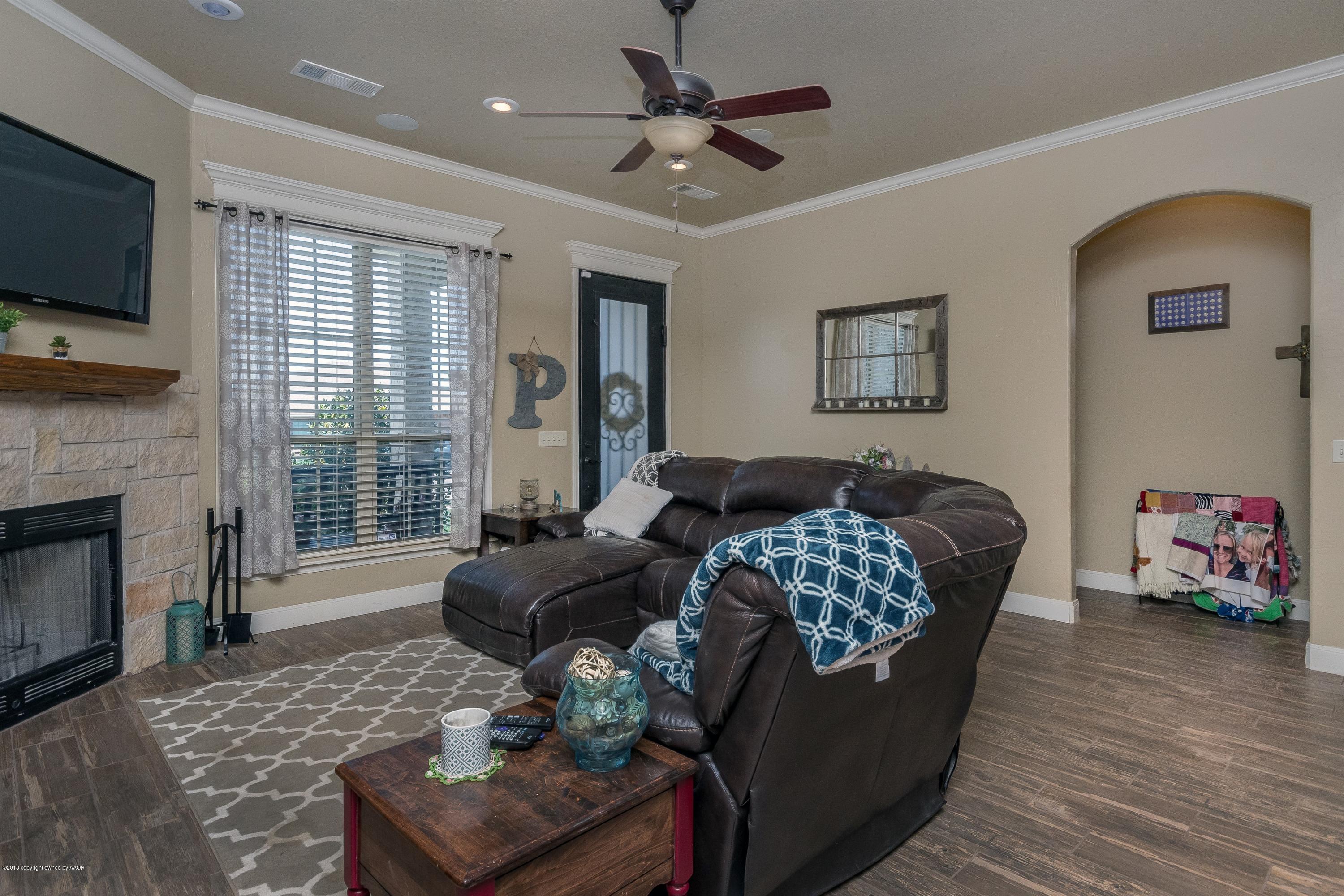 3909 Arden Road Amarillo, TX 79118 - Photo 5 of 20 a living room with furniture and a flat screen tv