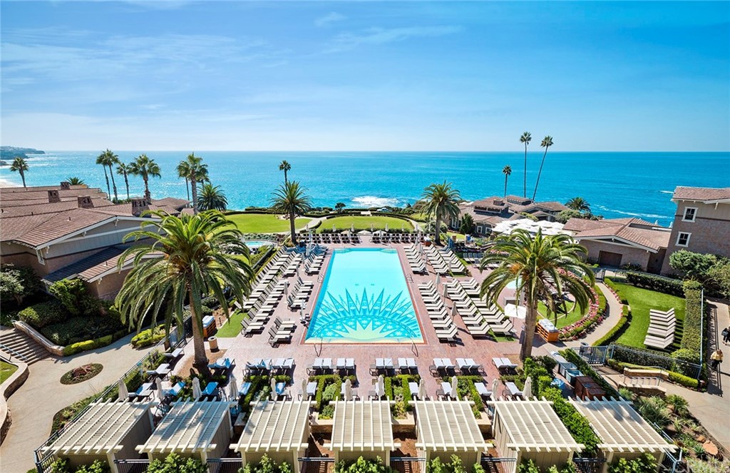 23 Montage Way Laguna Beach, CA 92651 - Photo 8 of 48 a view of a swimming pool with a table and chairs