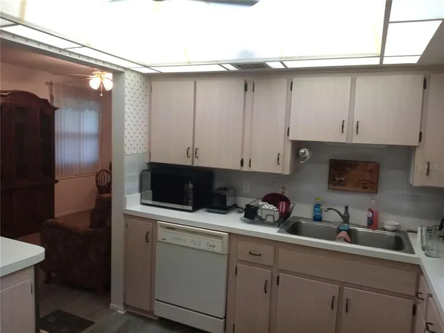 a white refrigerator freezer sitting in a kitchen