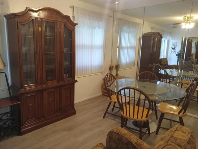 a bedroom with a bed and a mirror