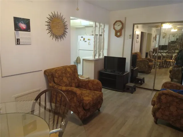 a bedroom with a bed and dresser