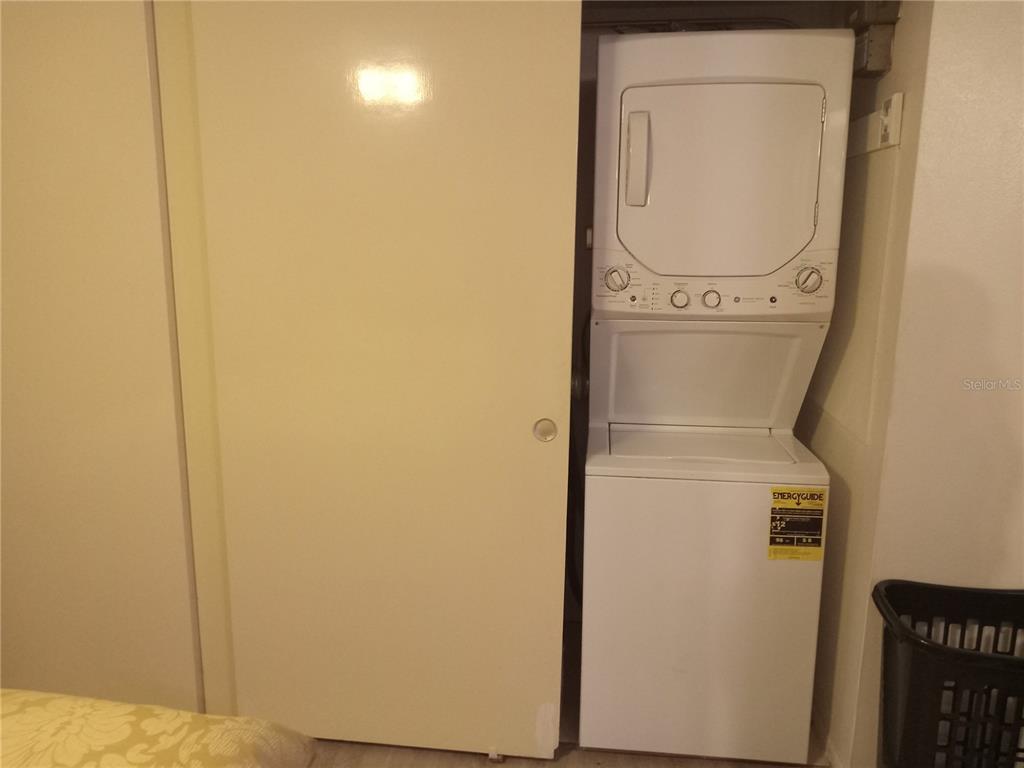 2467 Finlandia Lane, Unit 27 Clearwater, FL 33763 - Photo 26 of 58 a utility room with dryer and washer