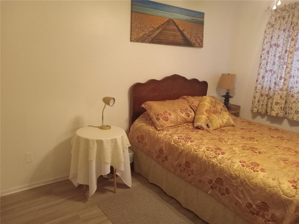 2467 Finlandia Lane, Unit 27 Clearwater, FL 33763 - Photo 33 of 58 a bedroom with a bed and a window