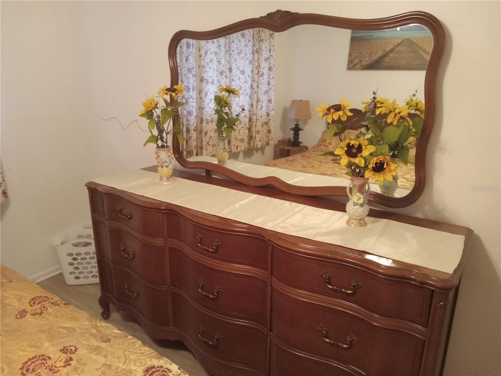 2467 Finlandia Lane, Unit 27 Clearwater, FL 33763 - Photo 35 of 58 a bathroom with a sink and a mirror