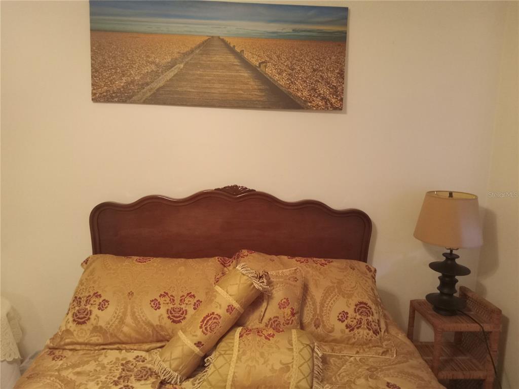 2467 Finlandia Lane, Unit 27 Clearwater, FL 33763 - Photo 36 of 58 a view of a bed in a bedroom