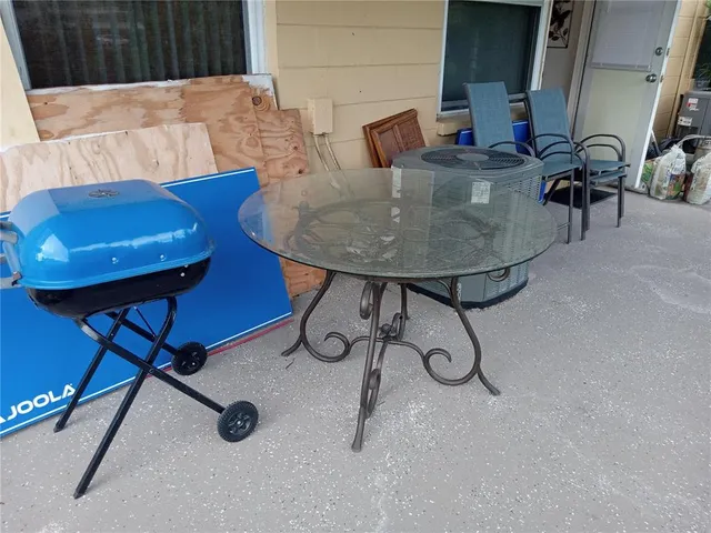 a view of a house with a yard and porch