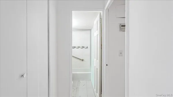 a bathroom with a glass shower door