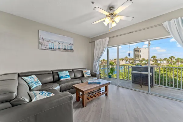 a view of a livingroom with furniture and window