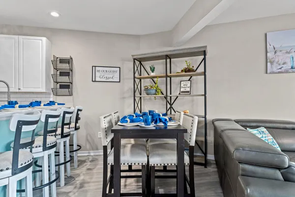 a kitchen with stainless steel appliances a sink cabinets and a refrigerator