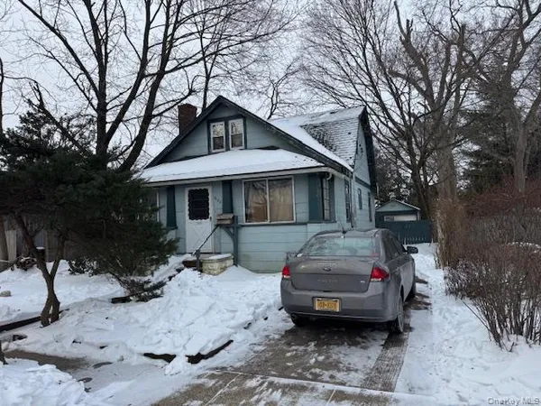 a car parked in front of a house