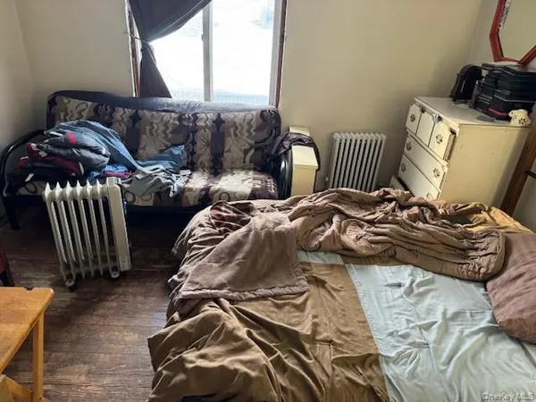 a bedroom with two beds and a couch