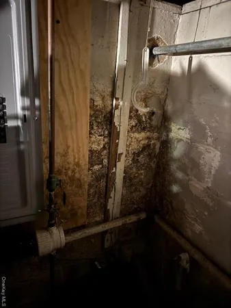 a view of a house with a yard covered in snow