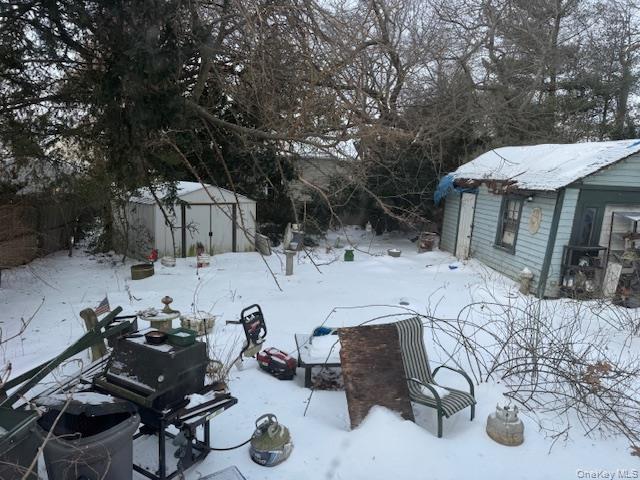 2122 Walnut Street Baldwin, NY 11510 - Photo 28 of 32 a view of a backyard with table and chairs under an umbrella