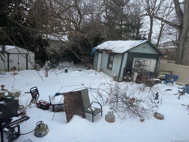 2122 Walnut Street Baldwin, NY 11510 - Photo 29 of 32 a view of a backyard house with a patio and snow