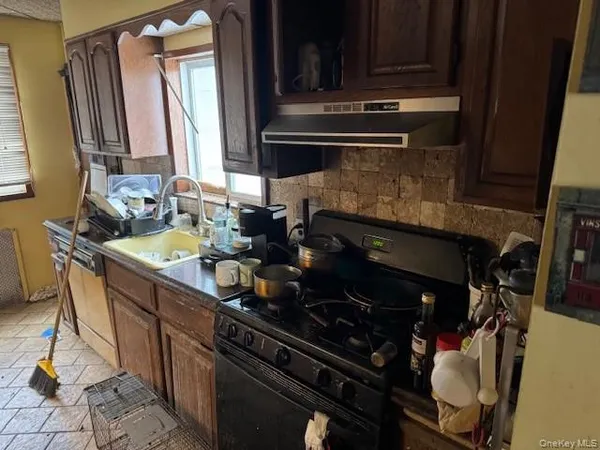 a kitchen with a stove and a sink
