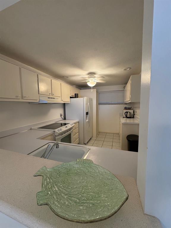 3580 South Ocean Boulevard, Unit 6C South Palm Beach, FL 33480 - Photo 7 of 12 a view of a kitchen with a sink