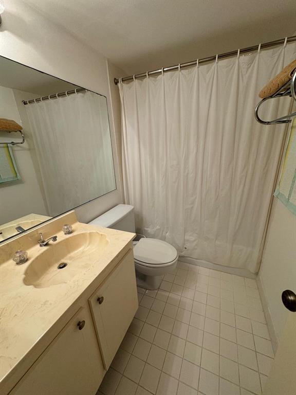 3580 South Ocean Boulevard, Unit 6C South Palm Beach, FL 33480 - Photo 8 of 12 a bathroom with a sink and a shower