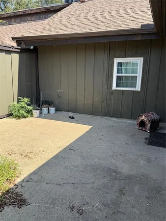 a view of backyard with jacuzzi