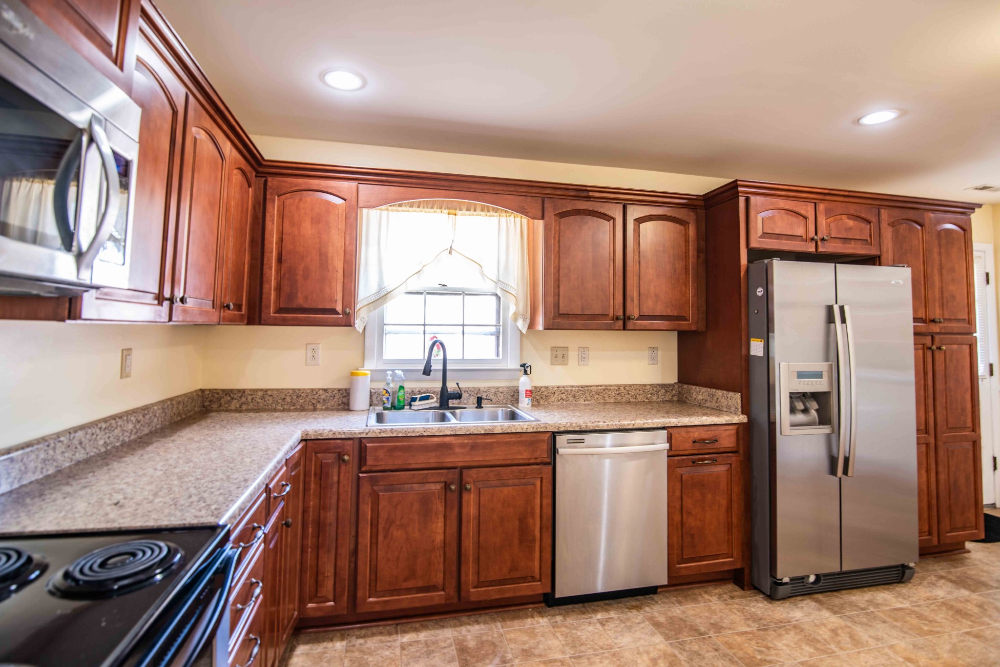 108 Fleming Street Tullahoma, TN 37388 - Photo 12 of 24 a kitchen with a sink stove and refrigerator