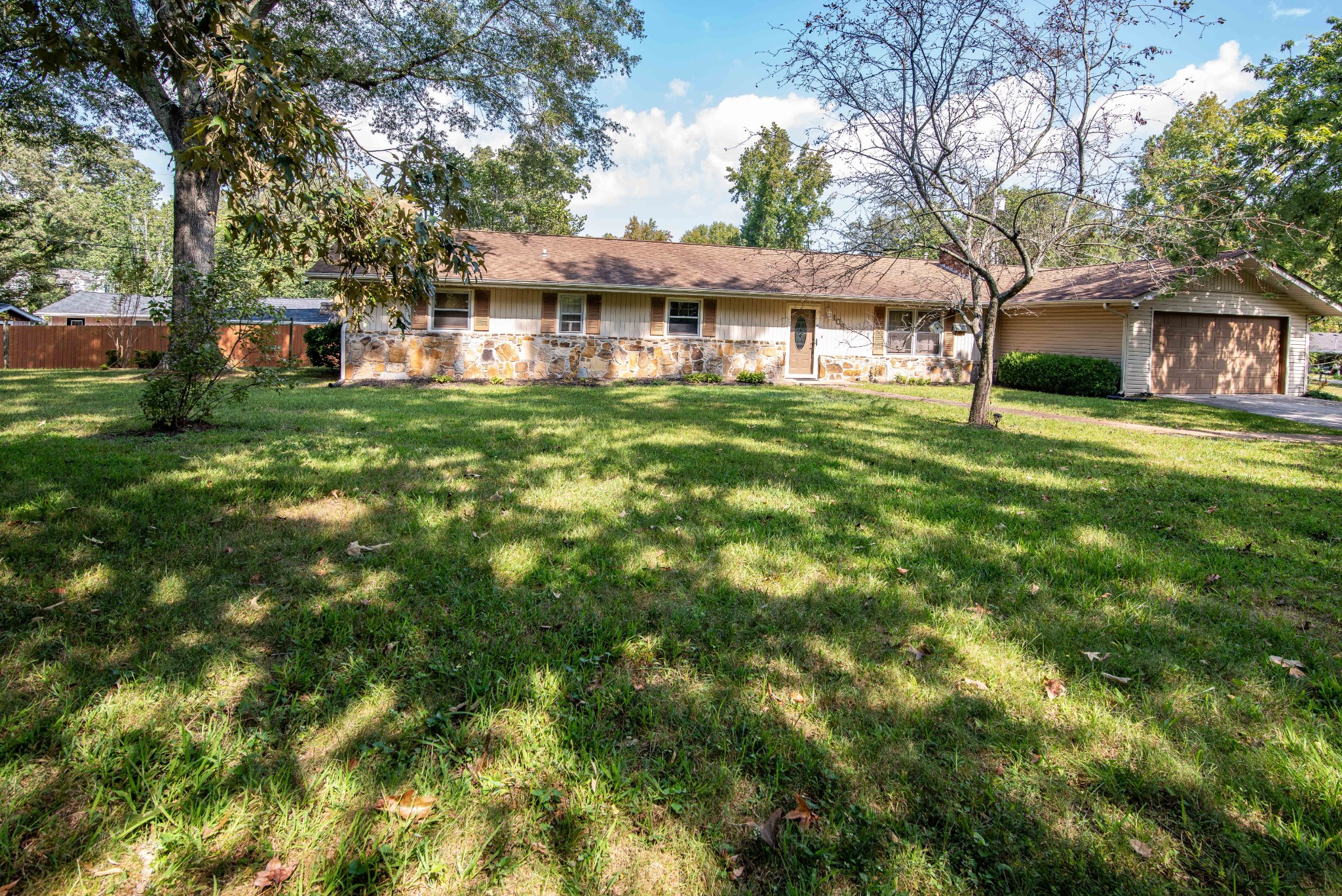 108 Fleming Street Tullahoma, TN 37388 - Photo 3 of 24 a front view of a house with a garden