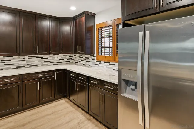 a kitchen with a sink and a refrigerator