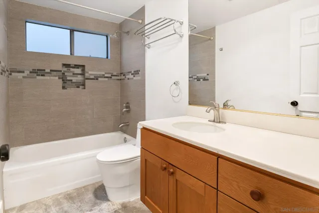 a bathroom with a sink a toilet and a bathtub