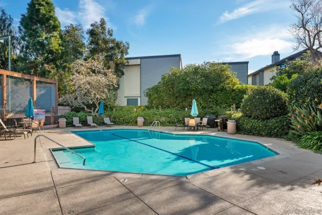 a view of a backyard with sitting area