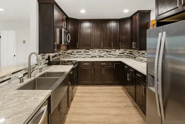 a kitchen with a sink and a stove