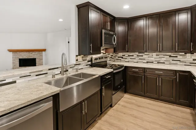 a kitchen with a sink and cabinets