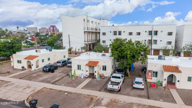 a view of multiple houses with a yard