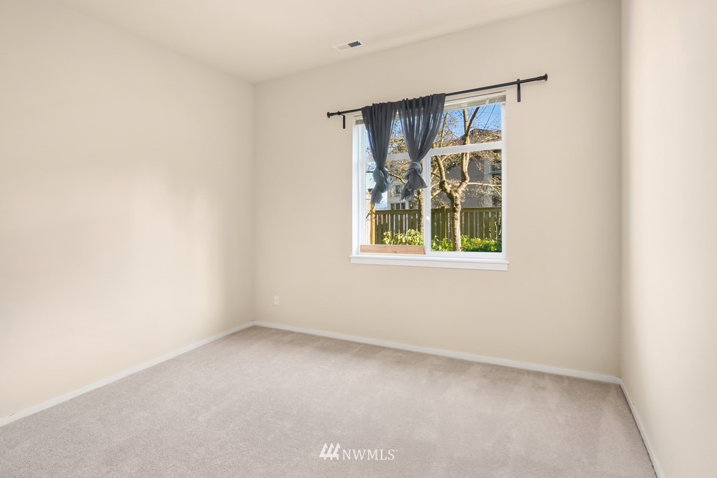 70 Cougar Ridge Road Northwest, Unit 2004 Issaquah, WA 98027 - Photo 17 of 27 a view of an empty room with a window